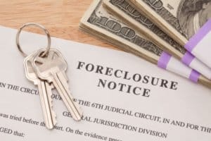 foreclosure notice documents with keys and cash