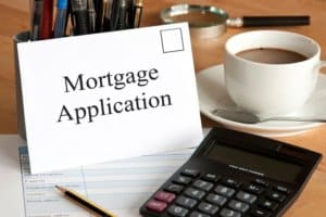 mortgage application white card & calculator